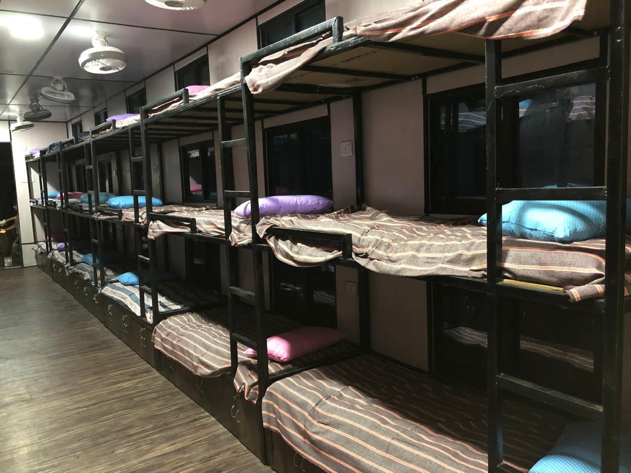 Finished interior of a portable multi-bed living unit